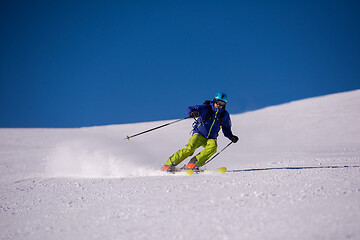 Image showing Skier having fun while running downhill