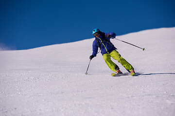 Image showing Skier having fun while running downhill