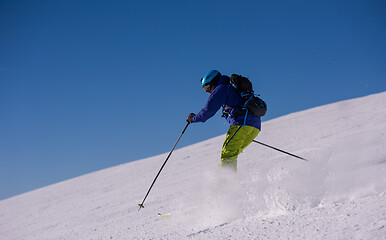 Image showing Skier having fun while running downhill