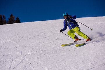 Image showing Skier having fun while running downhill