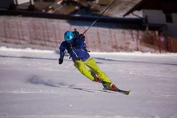 Image showing Skier having fun while running downhill