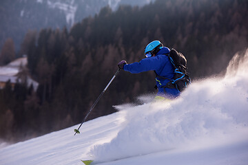 Image showing Skier having fun while running downhill