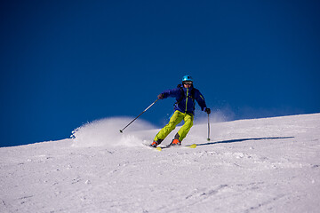 Image showing Skier having fun while running downhill