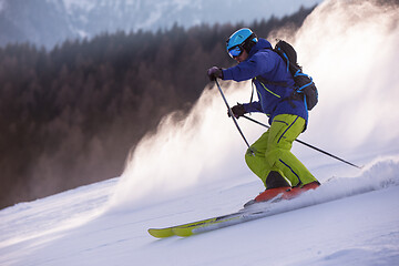 Image showing Skier having fun while running downhill