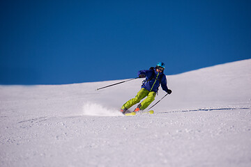 Image showing Skier having fun while running downhill