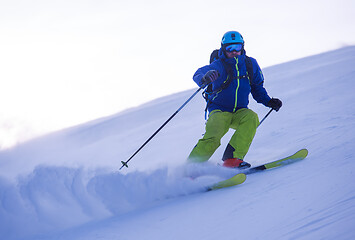 Image showing Skier having fun while running downhill