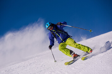 Image showing Skier having fun while running downhill