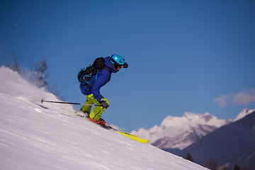 Image showing Skier having fun while running downhill