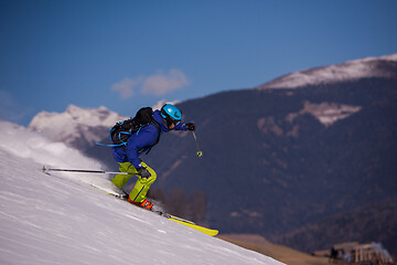 Image showing Skier having fun while running downhill