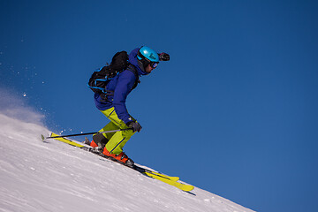 Image showing Skier having fun while running downhill