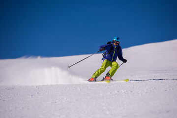 Image showing Skier having fun while running downhill