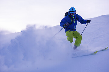 Image showing Skier having fun while running downhill