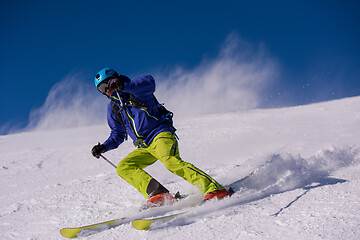 Image showing Skier having fun while running downhill