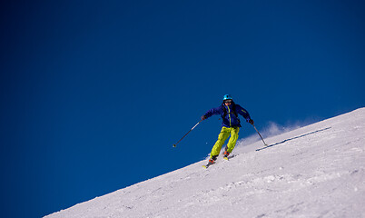 Image showing Skier having fun while running downhill