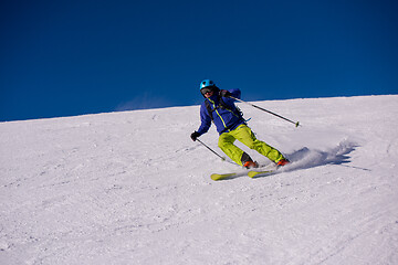 Image showing Skier having fun while running downhill