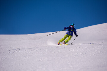 Image showing Skier having fun while running downhill