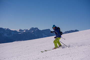 Image showing Skier having fun while running downhill