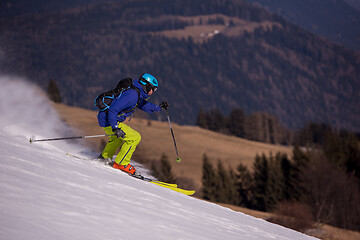 Image showing Skier having fun while running downhill