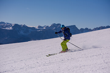 Image showing Skier having fun while running downhill