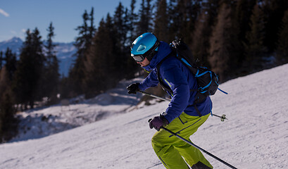 Image showing Skier having fun while running downhill