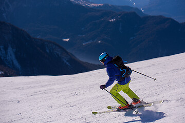 Image showing Skier having fun while running downhill