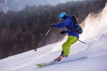 Image showing Skier having fun while running downhill