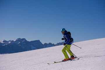 Image showing Skier having fun while running downhill