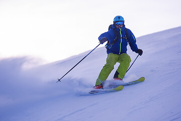 Image showing Skier having fun while running downhill