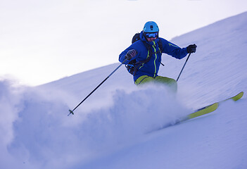 Image showing Skier having fun while running downhill