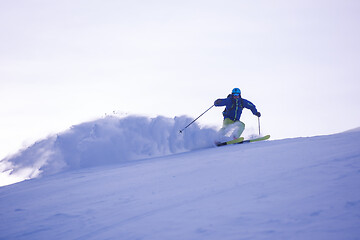 Image showing Skier having fun while running downhill