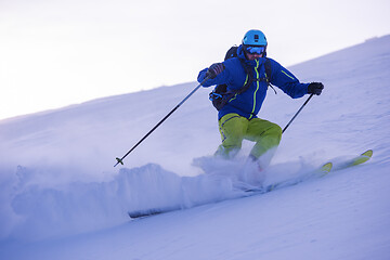 Image showing Skier having fun while running downhill