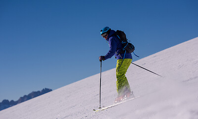 Image showing Skier having fun while running downhill