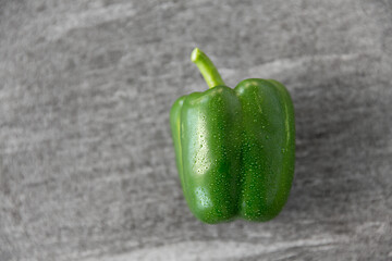 Image showing close up of green pepper on slate stone background