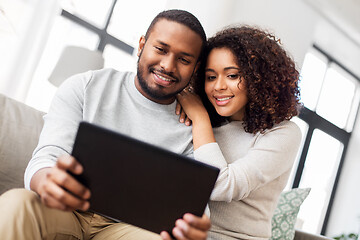 Image showing african american couple with tablet pc at home