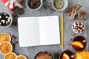 Image showing notebook, pencil and hot mulled wine on christmas