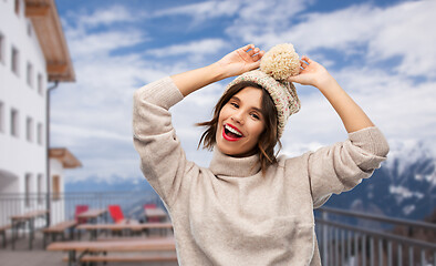 Image showing woman in winter hat and sweater at ski resort