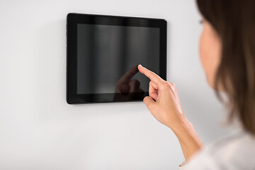 Image showing woman using tablet computer at smart home