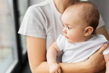 Image showing close up of mother holding little baby daughter