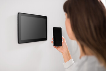 Image showing woman using tablet computer and smartphone