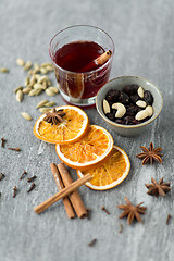 Image showing hot mulled wine, orange slices, raisins and spices