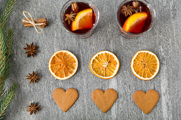 Image showing mulled wine, orange slices, gingerbread and spices