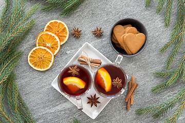 Image showing mulled wine, orange slices, gingerbread and spices