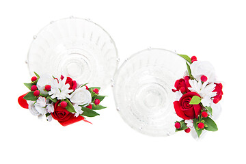 Image showing Crystal glasses with red flower decor