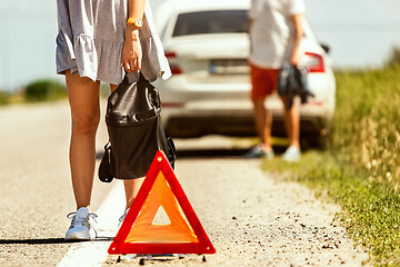 Image showing Young couple traveling on the car in sunny day