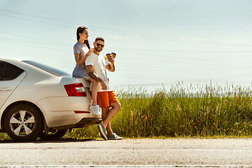 Image showing Young couple traveling on the car in sunny day