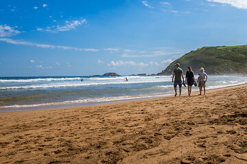 Image showing ZARAUTZ, SPAIN- JULY 11, 2020: View to the Zarautz Beach with walking people, Basque Country, Spain on a beautiful summer day