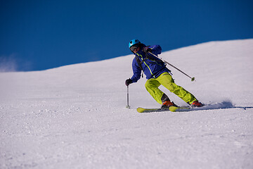 Image showing Skier having fun while running downhill