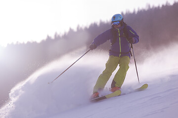 Image showing Skier having fun while running downhill