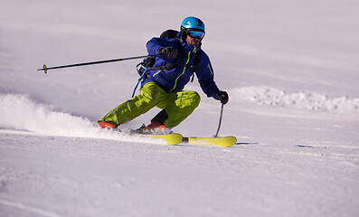 Image showing Skier having fun while running downhill