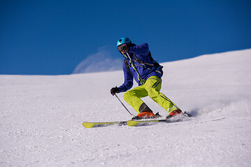 Image showing Skier having fun while running downhill